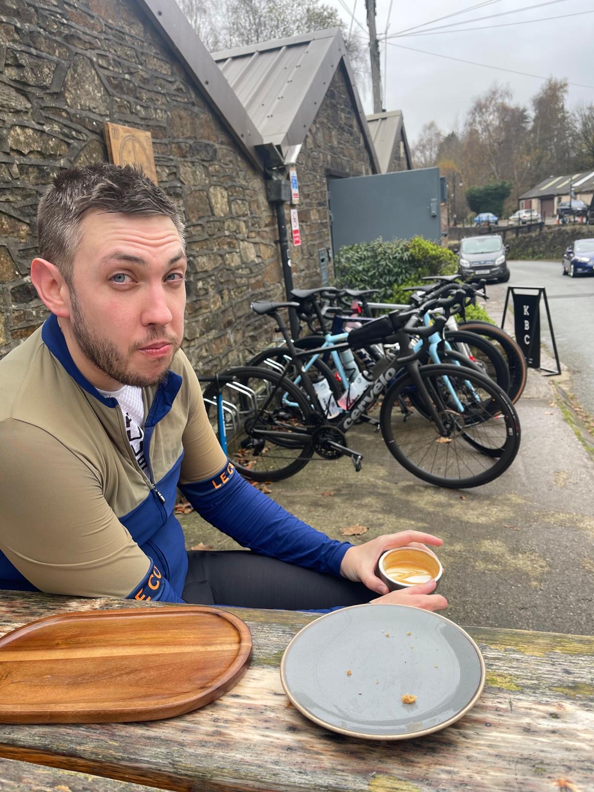 a picture of Luke at a cafe enjoying a coffee